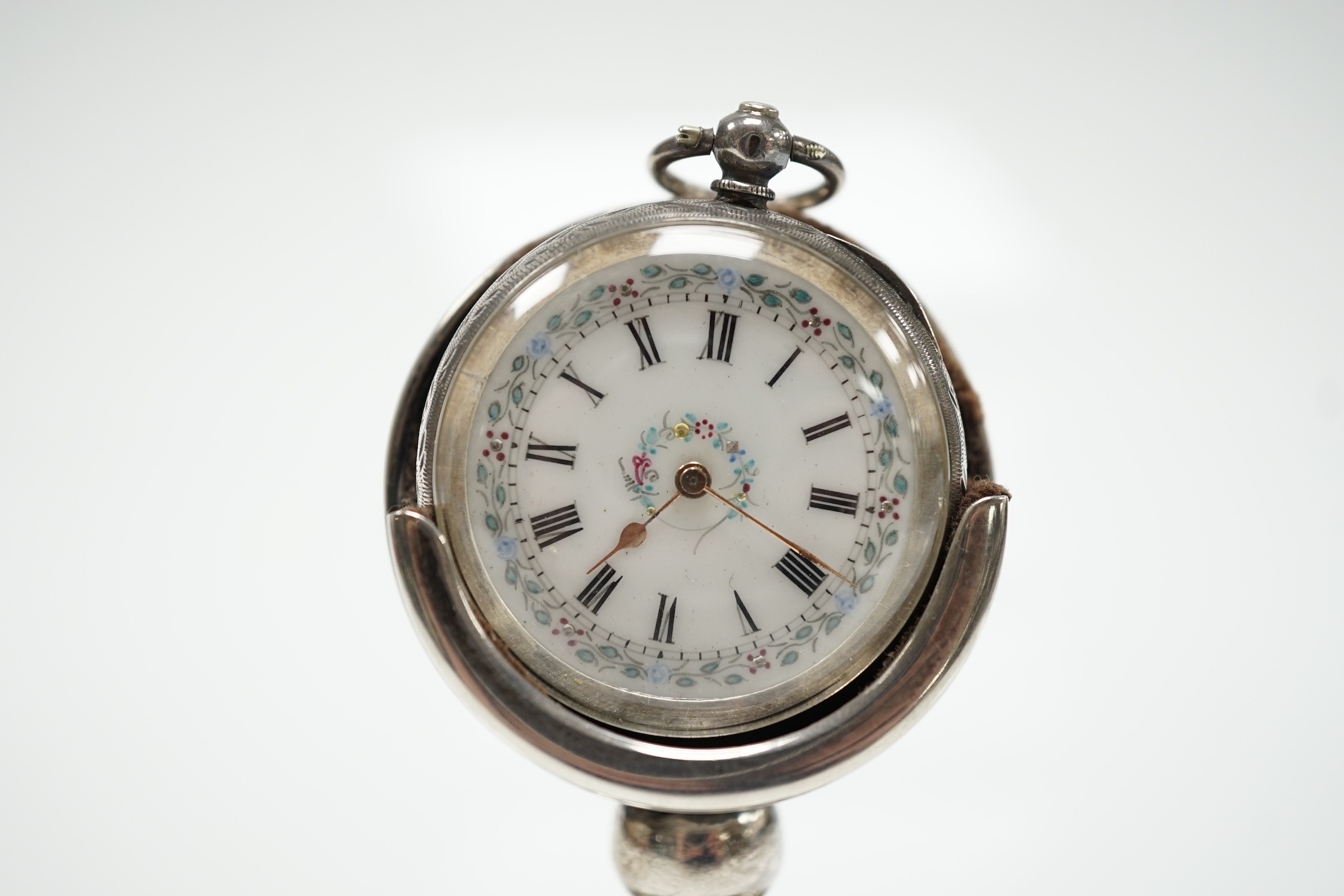 A George V silver mounted fob watch stand, Birmingham, 1923, 79mm, containing a Swiss white metal fob watch.